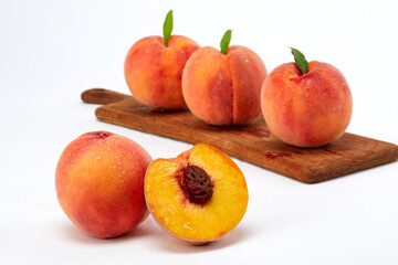 Fresh peaches and leaves