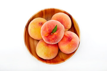 Fresh peaches and leaves