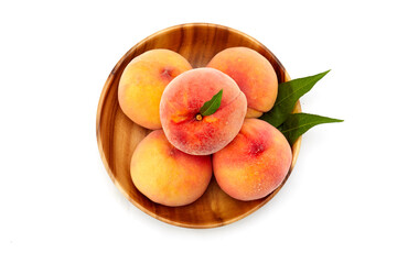 Fresh peaches and leaves