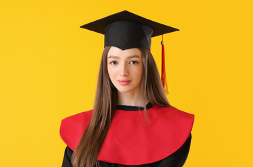 Female graduating student on color background