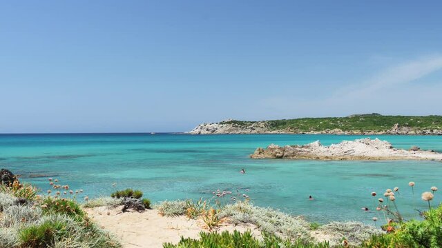 (Selective focus) Stunning view of a coastline bathed by a turquoise, clear sea. Rena Majore is a small seaside village that's located south of Santa Teresa Gallura, Sardinia, Italy.