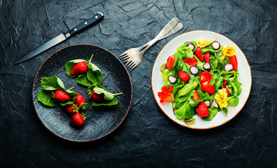 Summer salad with berries and herbs