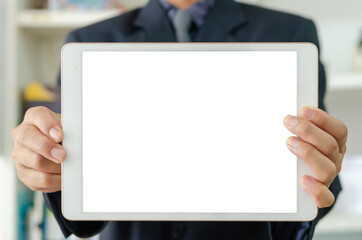 Businessman holding a blank white touch screen tablet. Used to put text or information to advertise news or sell products online. concept marketing business