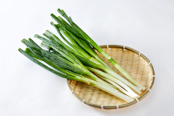 White background, green onions, vegetables.