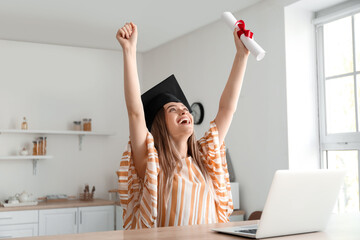 Happy female student on her graduation day at home. Concept of studying online - obrazy, fototapety, plakaty