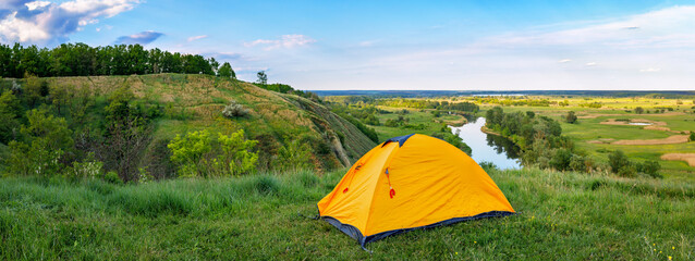 tourist tent on the hill near the river © alter_photo