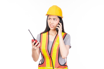 Female foreman with a safety helmet and smartphone. Woman professional builder, repairman or technician in yellow hardhat and workwear isolated on white background.