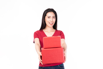 Fototapeta premium Asian women holding red present box. Portrait of happy smiling Asian girl in casual clothing holding gift box isolated on white. Happy pretty Asian woman holding red gift box on white background.