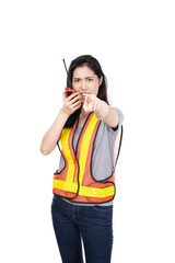 Beautiful Female foreman with a yellow safety helmet. Woman professional builder, repairman or technician in yellow hardhat and workwear isolated on white background.