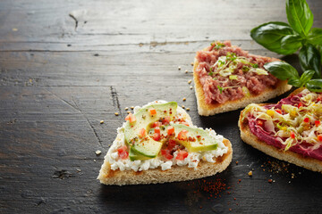 Appetizing healthy toasts on table
