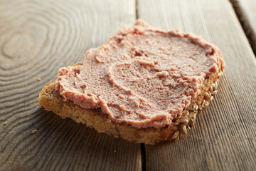 Toast with liver pate on table