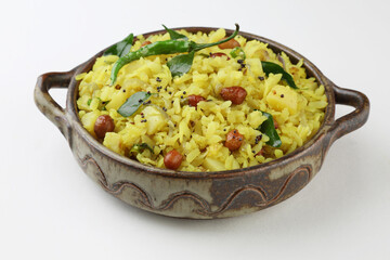 Indian Breakfast Dish Poha Also Know as Pohe or Aalu poha made up of Beaten Rice or Flattened Rice. The rice flakes are lightly fried in oil with mustard, turmeric, onion, curry leaves