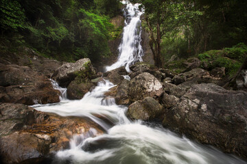 Beautiful Waterfall in Thailand. River stream flowing over rock formations in the mountains