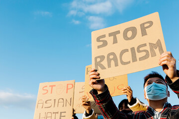 Demonstrators protesting against racism and fighting for equality - Activist movement against asian...