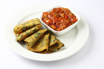 Thepla Indian flat bread,Methi Paratha,an Indian flatbread stuffed with fenugreek leaves and spices served with yogurt mango pickle & tomato chutney
in breakfast or brunch .
