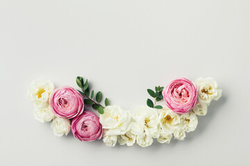 Beautiful floral arrangement with white and pink rose flowers for wedding card. Top view and flat lay style.