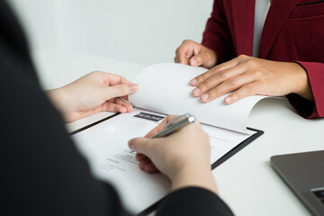 Business people hold a resume and talk to job applicants for job interviews about careers and Their personal history in the company. Recruitment concepts