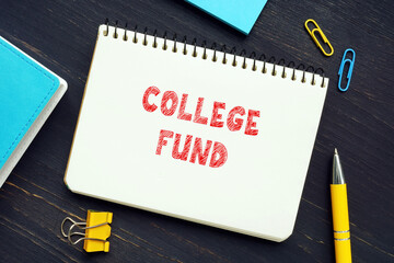 Business concept about COLLEGE FUND with sign on the page. Education savings plan accounts can generally be used at any college or university