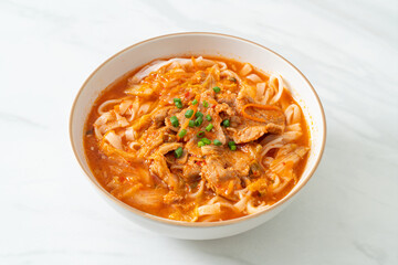 Korean udon ramen noodles with pork in kimchi soup
