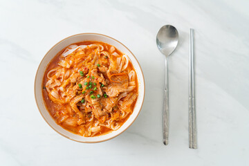 Korean udon ramen noodles with pork in kimchi soup