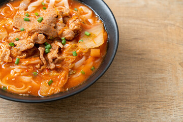 Korean udon ramen noodles with pork in kimchi soup