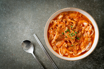 Korean udon ramen noodles with pork in kimchi soup