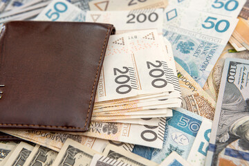 US dollar with polish zloty bills wallet business background