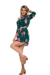 Young beautiful woman in floral summer dress