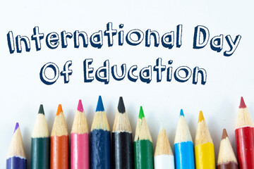 Phrase International Day Of Education on white background with colorful pencil. Education concept.