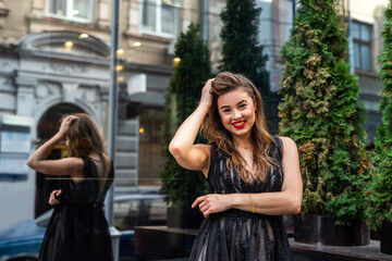 Portrait of pretty lady in evening black dress in outdoor