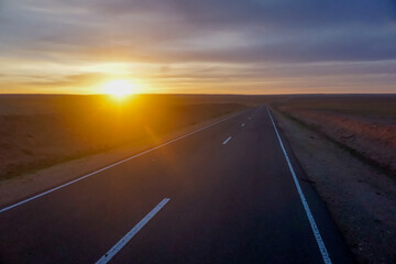 Naklejka na ściany i meble Beautiful sunset on the road in Mongolia