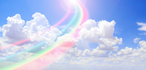 Horizontal nature banner with blue sky, pretty clouds and rainbow
