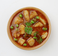 
Masala Aloo Sabzi or Indian potato gravy served with fried puri or Poori 