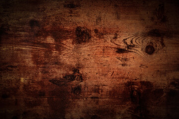 Dark rustic wooden background, abstract brown board dark surface with a place for text, for a banner or flier