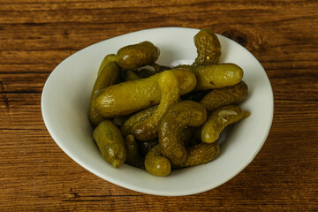 Pickled gherkin in the bowl