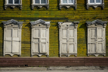 Fototapeta na wymiar Shutters of windows of an old house in Irkutsk, Siberia