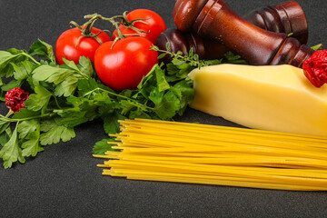 Raw Italian spaghetti heap with cheese