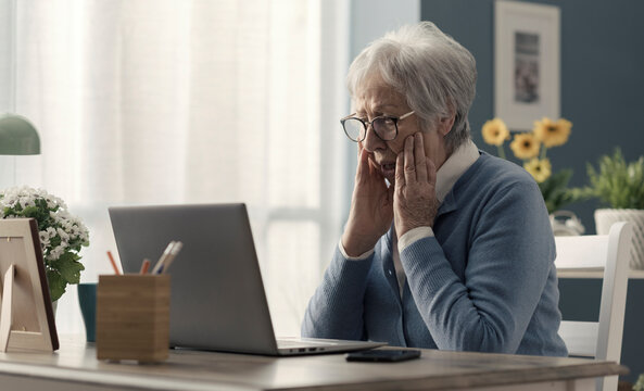 Senior woman struggling with technology
