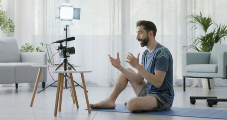 Professional personal trainer recording a video
