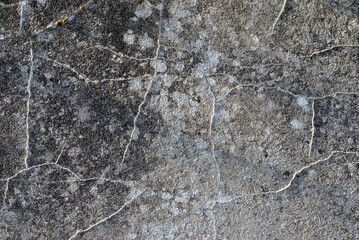 Close Up of Old Stained & Weathered Cement Wall with Cracks 