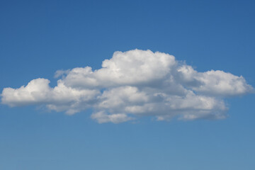 One white textured lonely cloud. Nature.