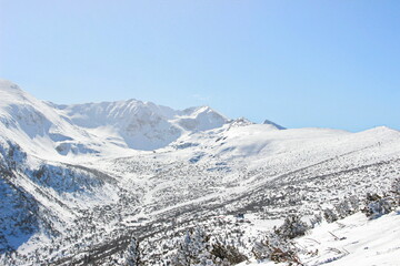 view of Borovets Gondola - view to the snowy mountains from the top station of Borovets Ski Resort, Bulgaria