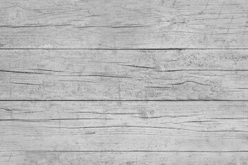 Naklejka premium Time-aged wooden board of gray color with cracks on the surface