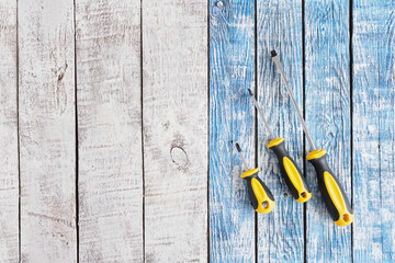 Screwdriver set on a wooden background top view copy space