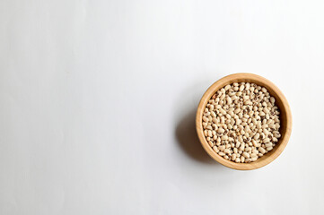 Top Views of Black-eyed white beans in a wooden bowl isolated on white background, Healthy Food Concept.