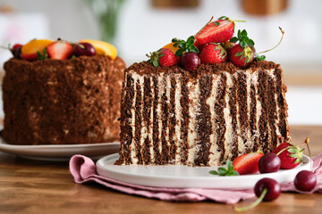 Chocolate cake with berries. Chocolate honey cake. Russian cake.