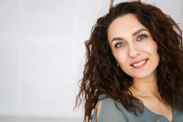 beautiful girl with gorgeous wavy dark hair. wears glasses. concept of beauty and health © Valeriya