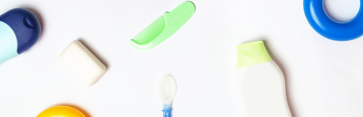 Baby bath products flat lay. Shampoo bottle, a small bottle of hair balm, natural soap. Mockup for design web site. Toiletries, kit