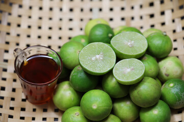 Limes with honey in a basket
