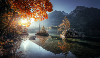 Scenic image of mountain landscape. Fairy tale view of Alpine Hintersee lake under sunlight. Stunning nature scenery during sunset. Concept of an ideal resting place and popular travel destination